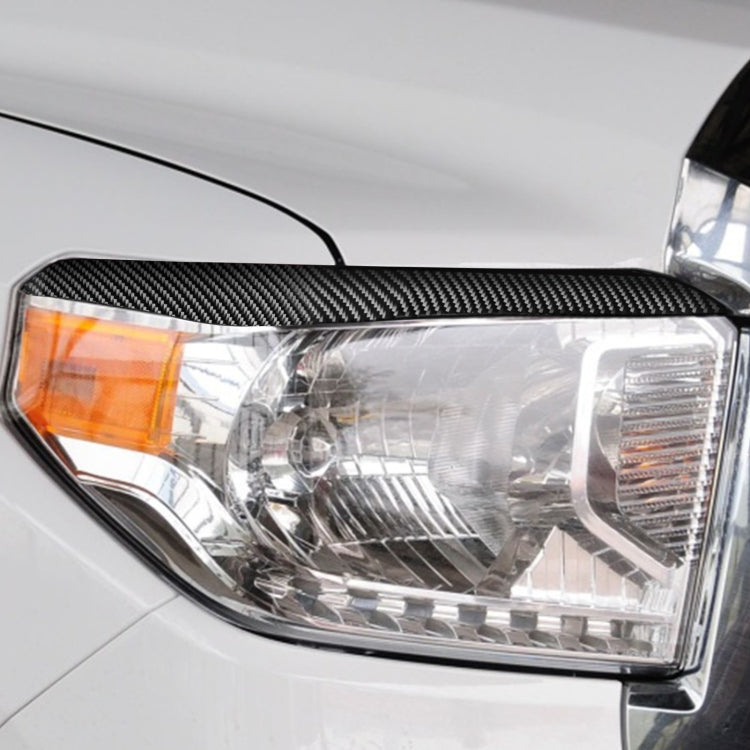 2 PCS / Set Carbon Fiber Car Headlight Eyebrow Decorative Sticker for Toyota Tundra 2014-2018, Left Right Driving