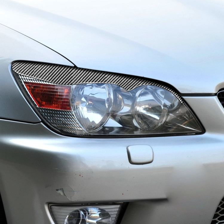 2 PCS / Set Carbon Fiber Car Lamp Eyebrow Decorative Sticker for Lexus IS200 1998-2005, Drop Glue Version