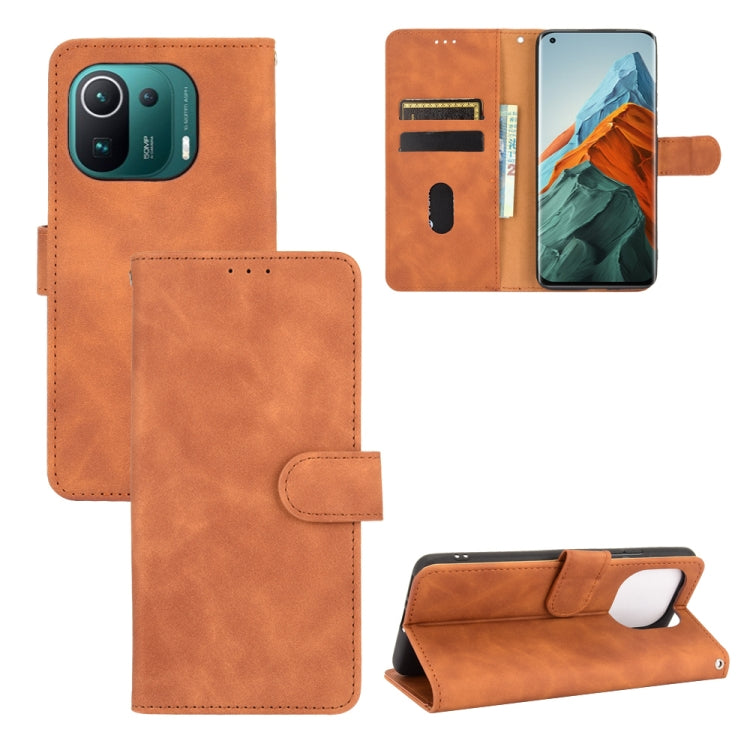 Solid Color Skin Feel Magnetic Buckle Horizontal Flip Calf Texture PU Leather Case with Holder & Card Slots & Wallet