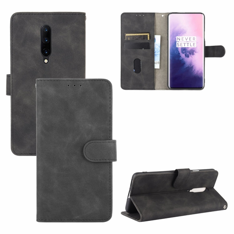 Solid Color Skin Feel Magnetic Buckle Horizontal Flip Calf Texture PU Leather Case with Holder & Card Slots & Wallet