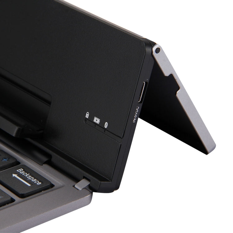 F18 Ultra-slim Rechargeable Foldable 58 Keys Bluetooth Wireless Keyboard with Holder — view 6