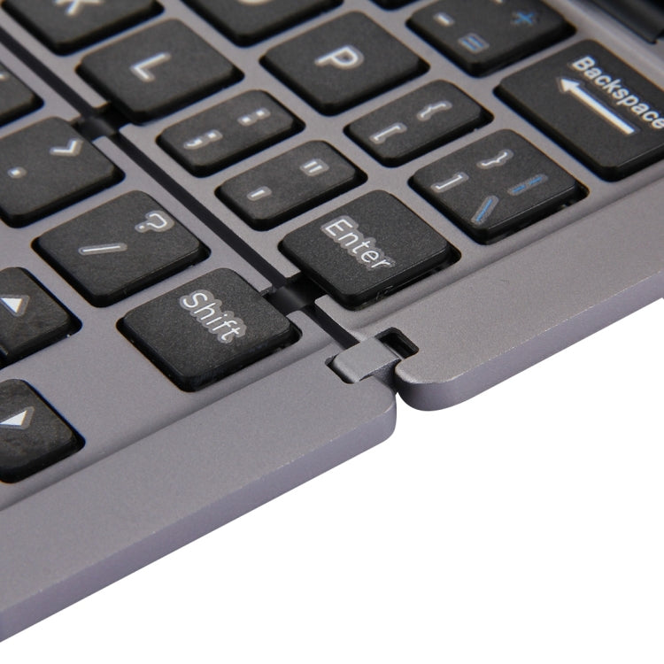 F18 Ultra-slim Rechargeable Foldable 58 Keys Bluetooth Wireless Keyboard with Holder — view 8